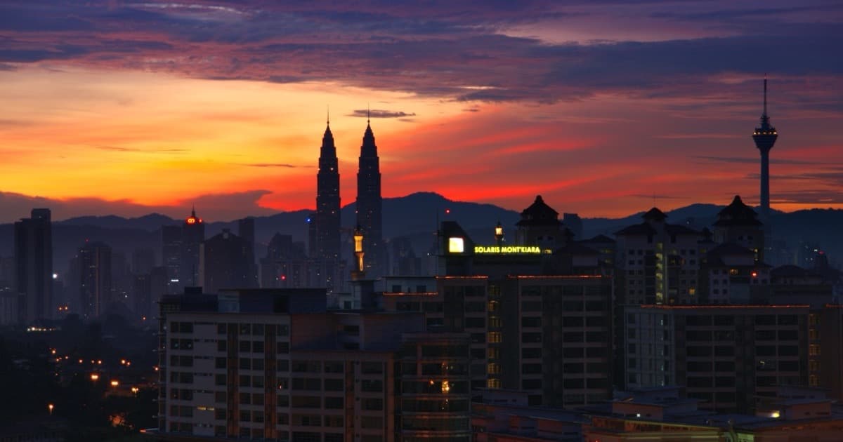 Kuala Lumpur sunrise skyline with Petronas Towers and KL Tower