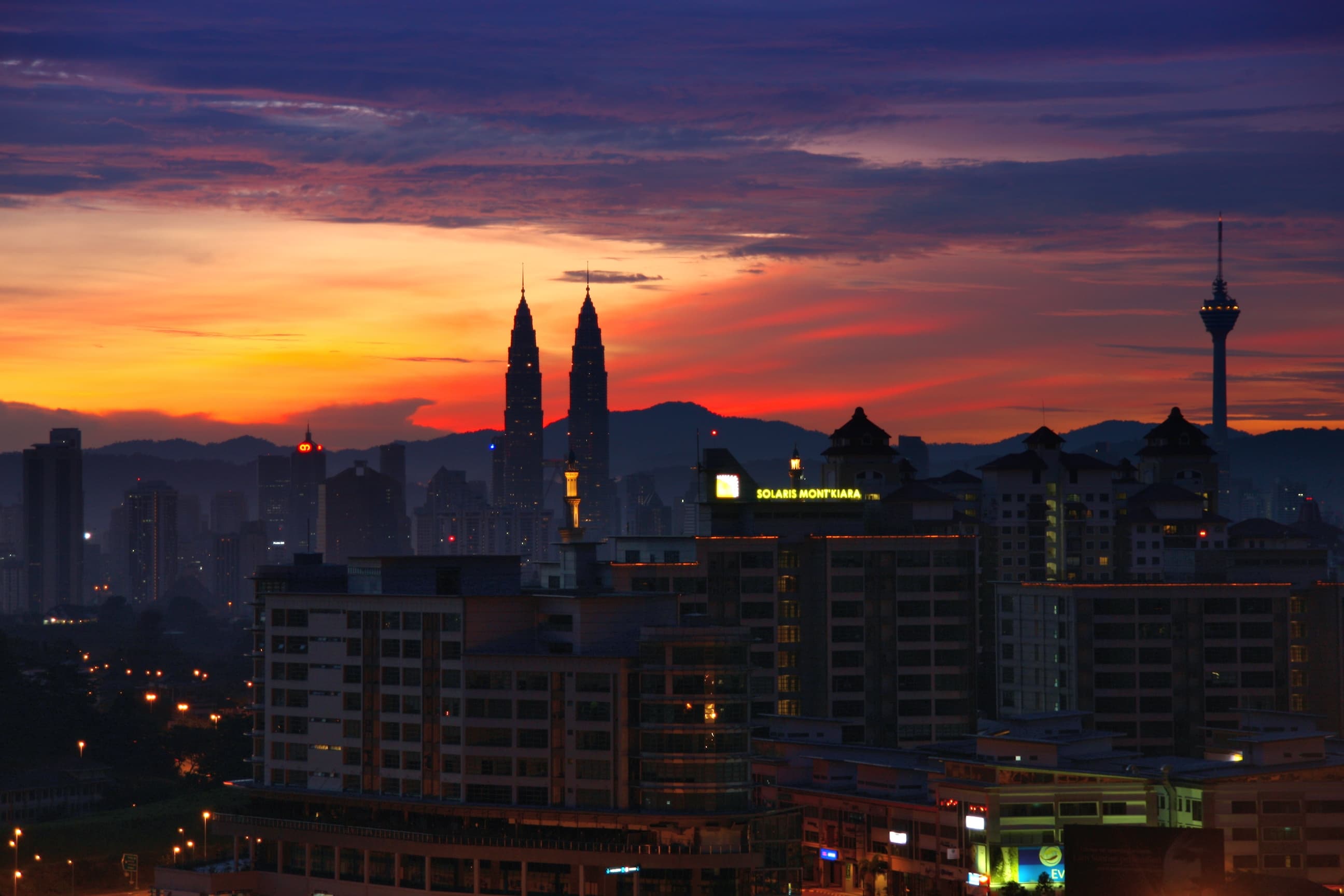 Kuala Lumpur sunrise skyline with Petronas Towers and KL Tower